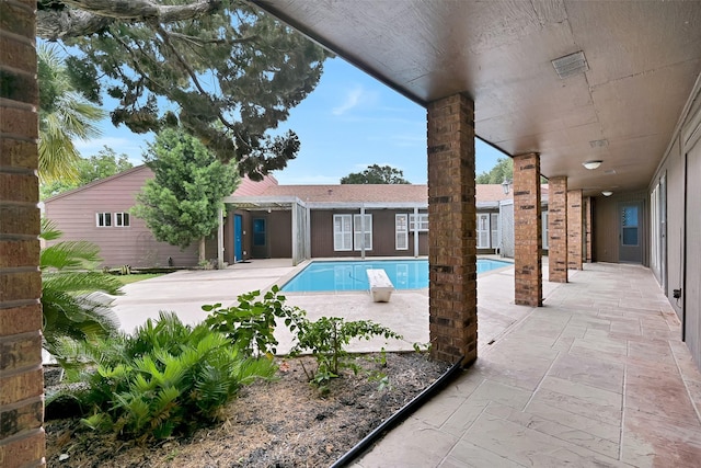 12 E Dansby Dr, Galveston, TX 77551 - swimming pool with a patio