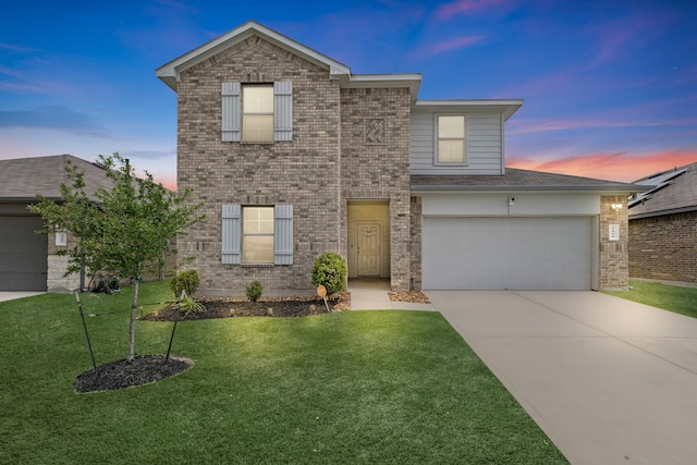 2431 Sutton Hollow Ct, Spring, TX 77373 - traditional-style home featuring driveway, brick siding, and a front lawn