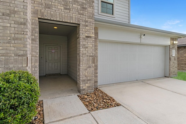 2431 Sutton Hollow Ct, Spring, TX 77373 - entrance to property featuring brick siding and an attached garage