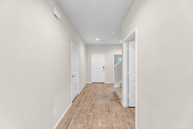 2431 Sutton Hollow Ct, Spring, TX 77373 - corridor with light wood-style floors, recessed lighting, and stairs