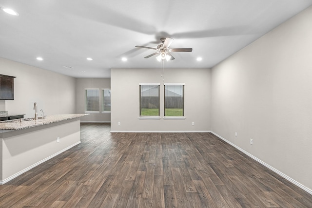 2431 Sutton Hollow Ct, Spring, TX 77373 - unfurnished living room featuring a ceiling fan, dark wood-style floors, and recessed lighting
