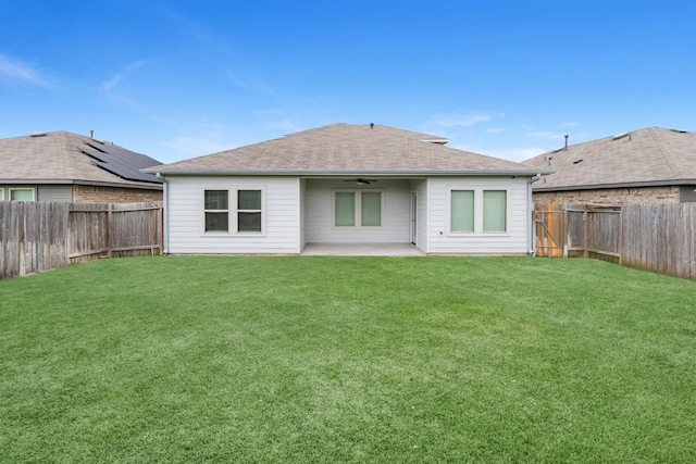 2431 Sutton Hollow Ct, Spring, TX 77373 - back of house with a ceiling fan, a fenced backyard, a patio area, and a shingled roof