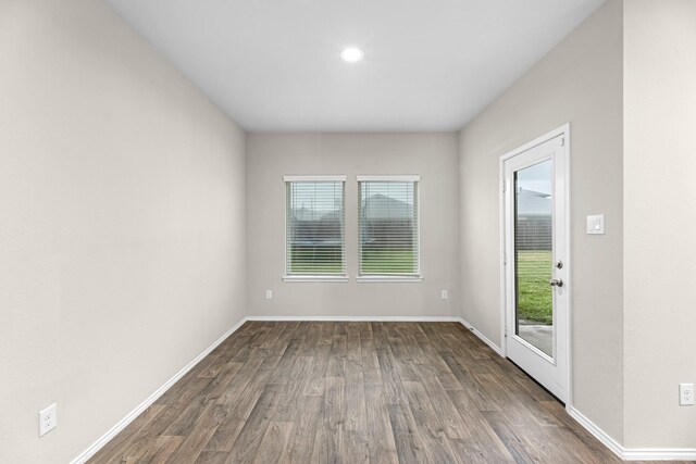 2431 Sutton Hollow Ct, Spring, TX 77373 - empty room with dark wood-type flooring and recessed lighting