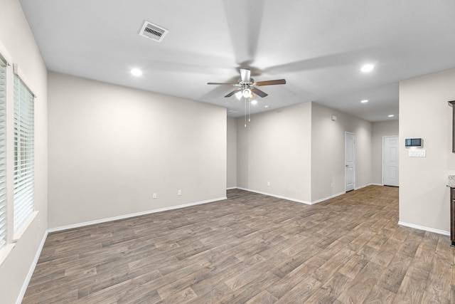 2431 Sutton Hollow Ct, Spring, TX 77373 - spare room featuring wood finished floors, a ceiling fan, and recessed lighting