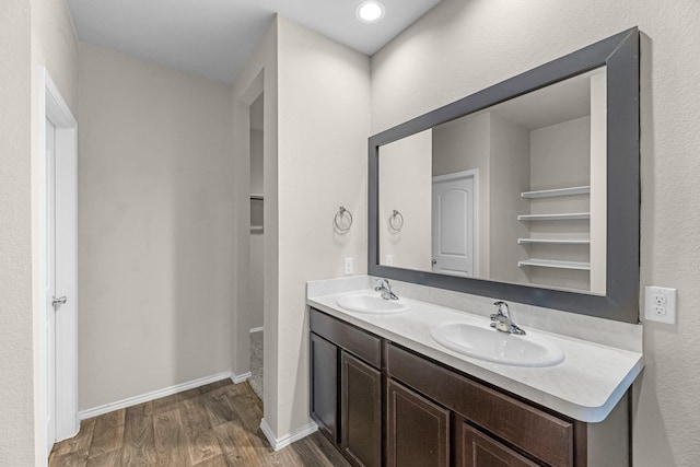 2431 Sutton Hollow Ct, Spring, TX 77373 - full bath with wood finished floors and double vanity