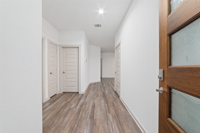 7002 Halifax Harvest Ln, Richmond, TX 77407 - hallway with wood finished floors and baseboards