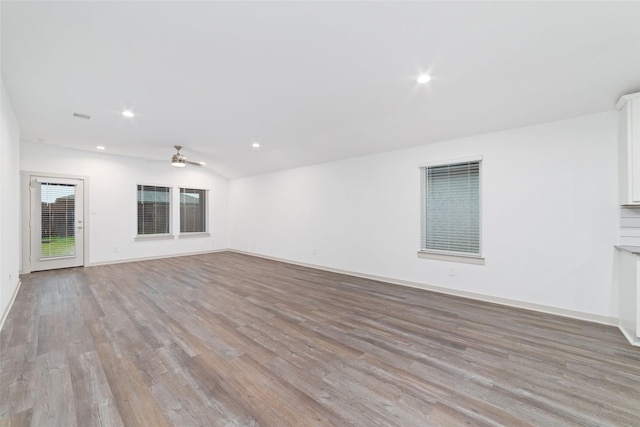 7002 Halifax Harvest Ln, Richmond, TX 77407 - unfurnished living room featuring light wood finished floors, a ceiling fan, and recessed lighting