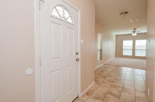 6042 Wesley Manor Ct, Katy, TX 77449 - entrance foyer featuring a ceiling fan, light colored carpet, and light tile patterned flooring
