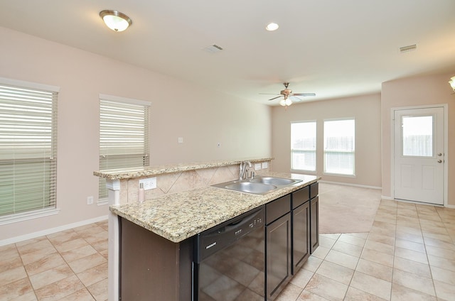 6042 Wesley Manor Ct, Katy, TX 77449 - kitchen featuring dishwasher, light tile patterned floors, a ceiling fan, a kitchen island with sink, and tasteful backsplash