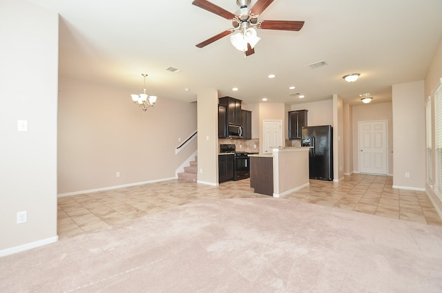 6042 Wesley Manor Ct, Katy, TX 77449 - unfurnished living room with light tile patterned flooring, a chandelier, ceiling fan, recessed lighting, and light colored carpet