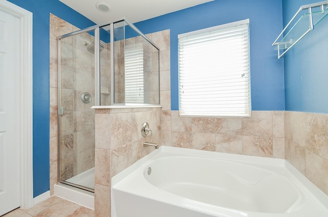 6042 Wesley Manor Ct, Katy, TX 77449 - full bathroom featuring a bath, a stall shower, and tile patterned flooring