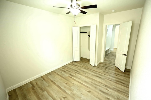 9002 Lacombe Ln, Tomball, TX 77375 - unfurnished bedroom with light wood-type flooring, ceiling fan, and a closet