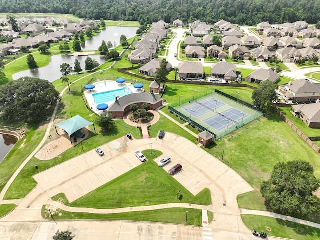 9002 Lacombe Ln, Tomball, TX 77375 - aerial perspective of suburban area with a nearby body of water and a pool