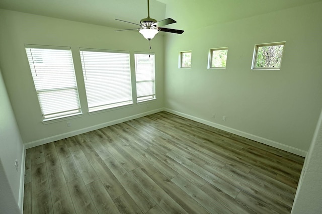 9002 Lacombe Ln, Tomball, TX 77375 - unfurnished room featuring wood finished floors and a ceiling fan