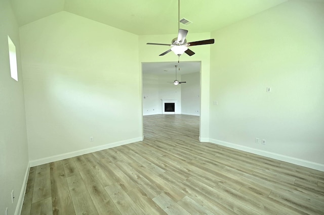 9002 Lacombe Ln, Tomball, TX 77375 - spare room featuring a ceiling fan, light wood finished floors, and lofted ceiling