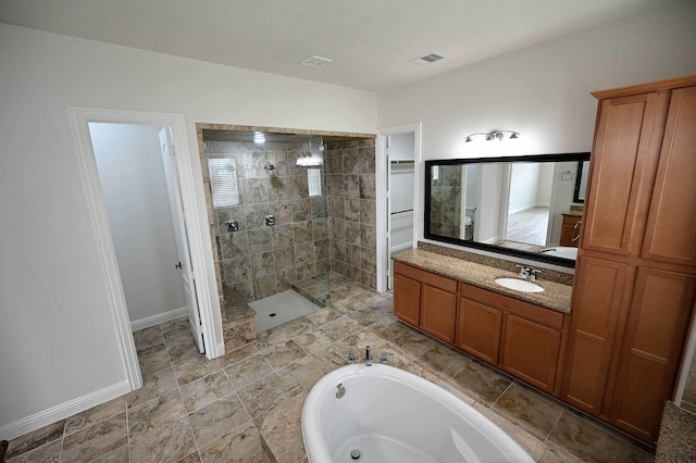 9002 Lacombe Ln, Tomball, TX 77375 - bathroom featuring a walk in shower, vanity, and a bath