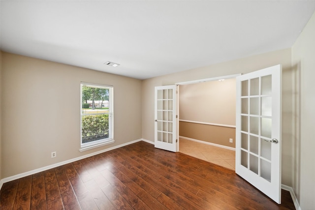 4117 Tilson Ln, Houston, TX 77080 - empty room with french doors and wood finished floors