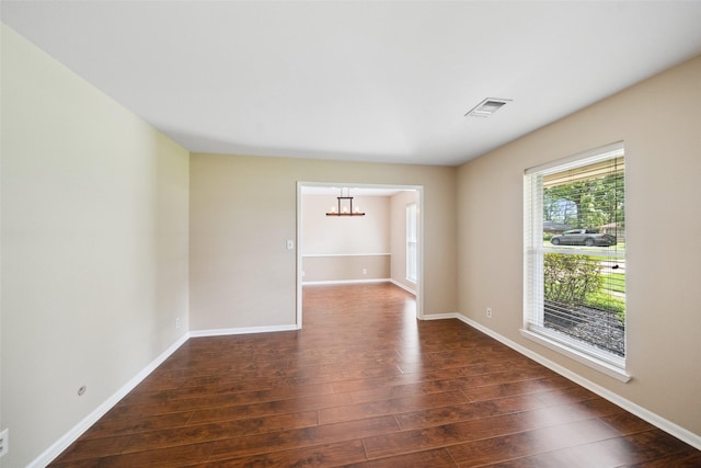 4117 Tilson Ln, Houston, TX 77080 - unfurnished room with a chandelier and dark wood-style flooring