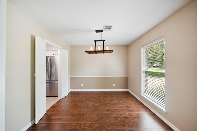 4117 Tilson Ln, Houston, TX 77080 - spare room with dark wood-style flooring and a chandelier