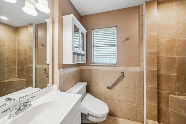 4117 Tilson Ln, Houston, TX 77080 - full bath featuring tile walls, vanity, a tile shower, tile patterned flooring, and a wainscoted wall