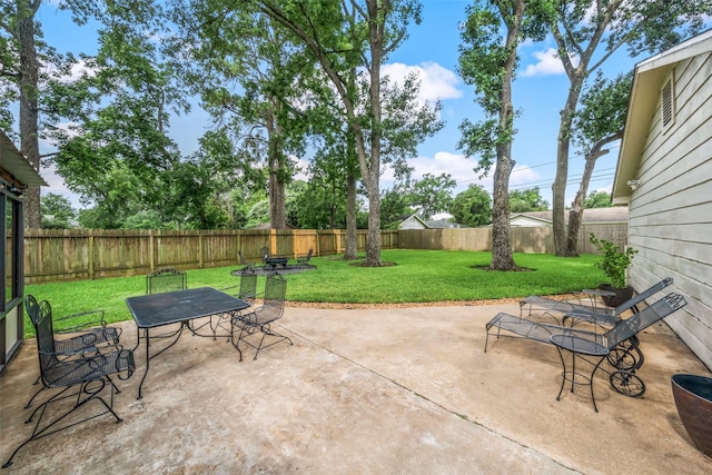 4117 Tilson Ln, Houston, TX 77080 - fenced backyard featuring outdoor dining space and a patio