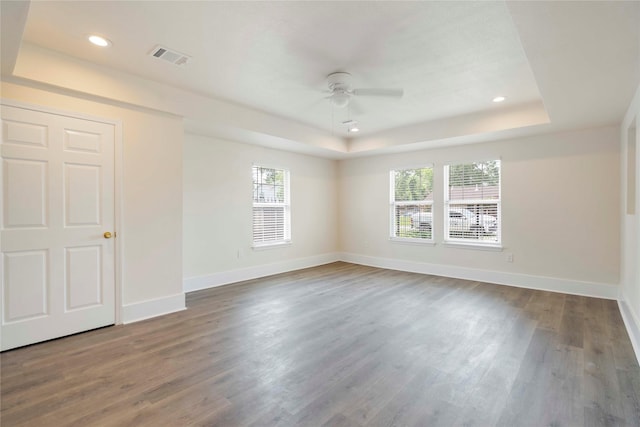 798 Fair St, Houston, TX 77088 - spare room featuring a ceiling fan, a raised ceiling, wood finished floors, and recessed lighting