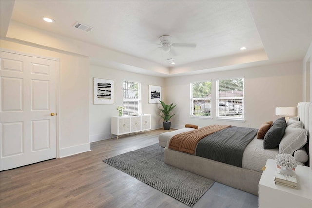 798 Fair St, Houston, TX 77088 - bedroom featuring wood finished floors, a raised ceiling, recessed lighting, and a ceiling fan