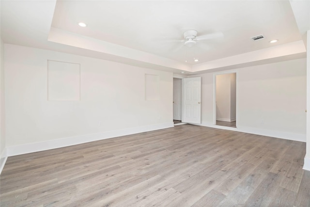 798 Fair St, Houston, TX 77088 - unfurnished room featuring a raised ceiling, recessed lighting, light wood-type flooring, and ceiling fan