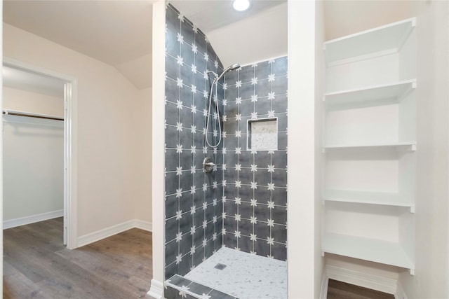 798 Fair St, Houston, TX 77088 - full bath with a stall shower, wood finished floors, a walk in closet, and lofted ceiling