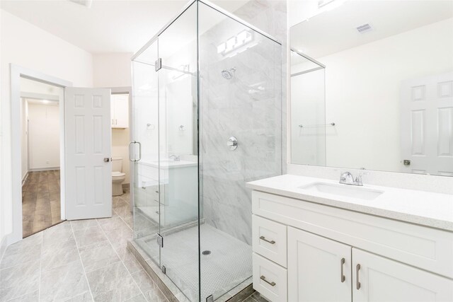 4538 White Rock St, Houston, TX 77051 - bathroom featuring a stall shower, vanity, and marble look tile flooring