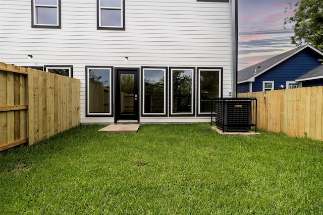 4538 White Rock St, Houston, TX 77051 - back of property at dusk with a fenced backyard