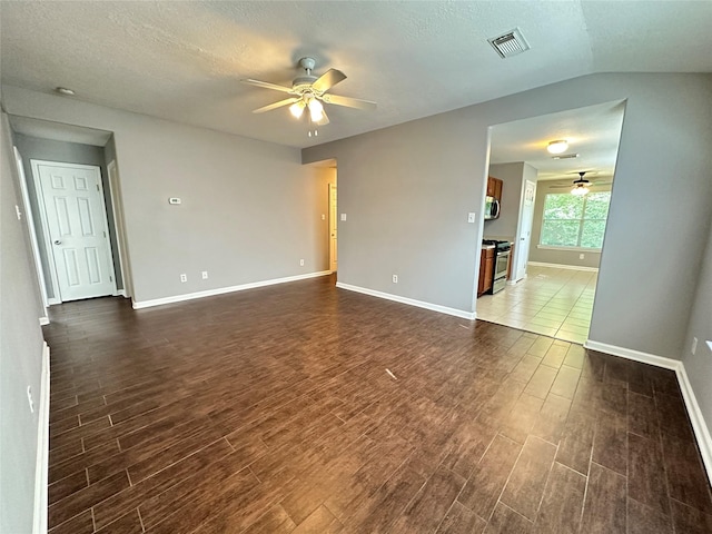 2827 Cypress Island Dr, Houston, TX 77073 - unfurnished room with a ceiling fan, dark wood-style floors, and a textured ceiling