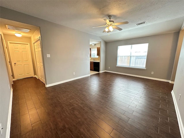 2827 Cypress Island Dr, Houston, TX 77073 - unfurnished room with dark wood-style flooring, ceiling fan, and a textured ceiling