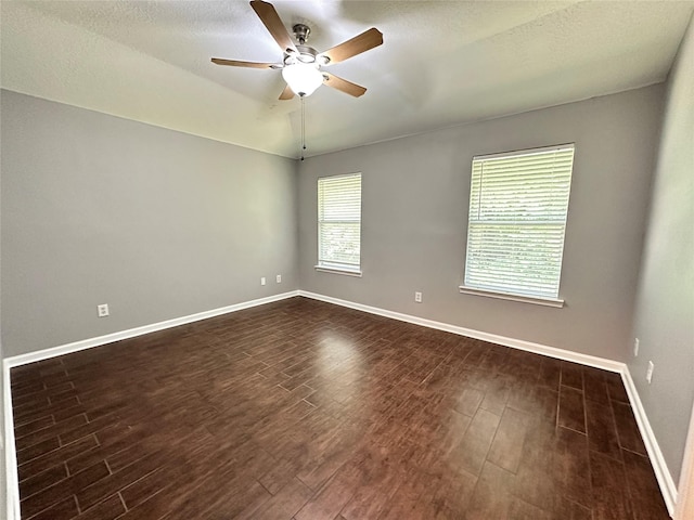 2827 Cypress Island Dr, Houston, TX 77073 - spare room featuring dark wood-style floors, ceiling fan, and a textured ceiling