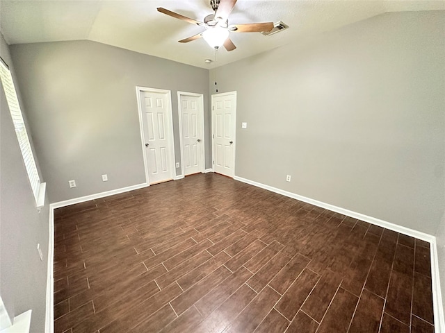 2827 Cypress Island Dr, Houston, TX 77073 - unfurnished bedroom with lofted ceiling, dark wood-style floors, a ceiling fan, and multiple windows