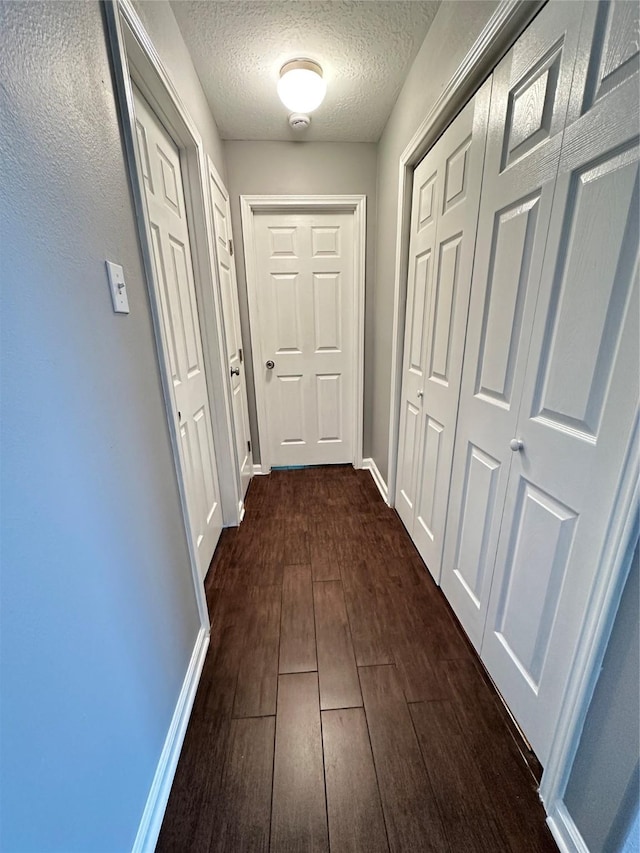 2827 Cypress Island Dr, Houston, TX 77073 - corridor with a textured ceiling and dark wood finished floors