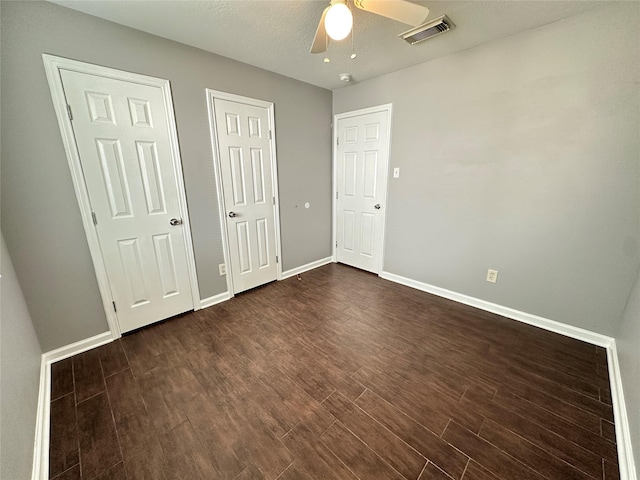 2827 Cypress Island Dr, Houston, TX 77073 - unfurnished bedroom featuring dark wood-type flooring and ceiling fan