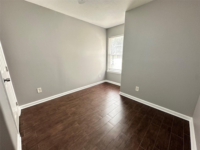 2827 Cypress Island Dr, Houston, TX 77073 - spare room with dark wood-type flooring and a textured ceiling