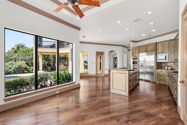 3045 S Island Dr, Seabrook, TX 77586 - kitchen with built in appliances, ornamental molding, plenty of natural light, recessed lighting, and backsplash