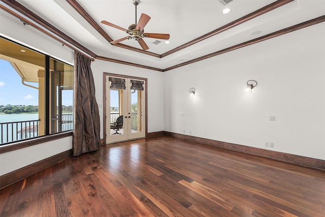 3045 S Island Dr, Seabrook, TX 77586 - unfurnished room with a raised ceiling, french doors, wood finished floors, ornamental molding, and a ceiling fan
