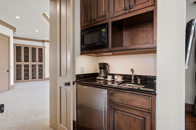 3045 S Island Dr, Seabrook, TX 77586 - indoor wet bar with stainless steel fridge, black microwave, ornamental molding, recessed lighting, and carpet flooring