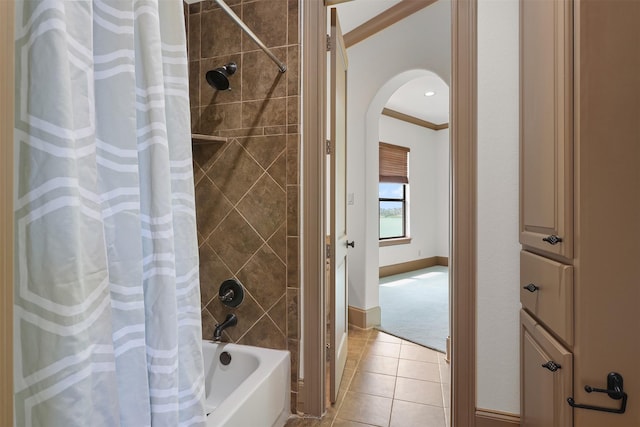 3045 S Island Dr, Seabrook, TX 77586 - bathroom featuring ornamental molding, shower / bath combo with shower curtain, and tile patterned floors