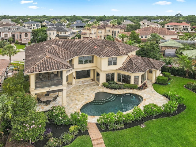 3045 S Island Dr, Seabrook, TX 77586 - swimming pool with a residential view, a patio area, and a lawn