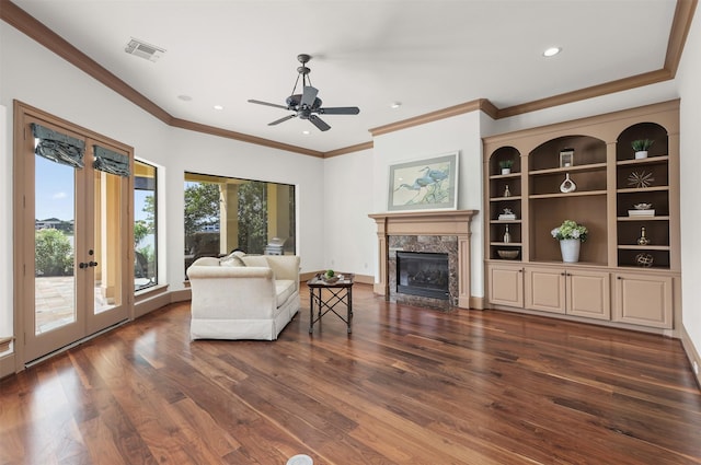 3045 S Island Dr, Seabrook, TX 77586 - living room with a fireplace, dark wood-style floors, crown molding, ceiling fan, and recessed lighting