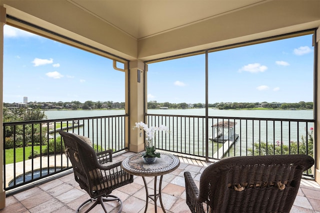 3045 S Island Dr, Seabrook, TX 77586 - sunroom with a water view and stone tile floors