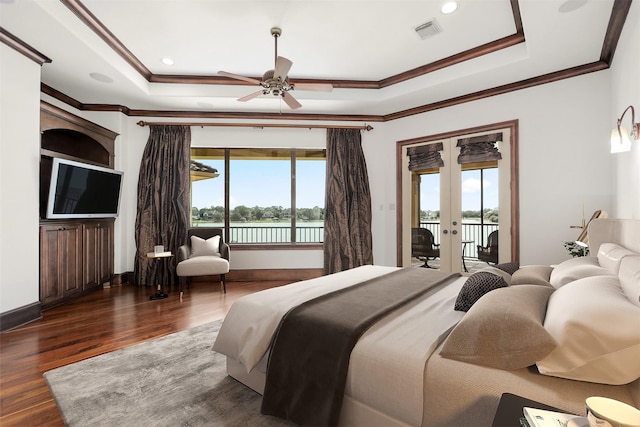 3045 S Island Dr, Seabrook, TX 77586 - bedroom featuring multiple windows, access to exterior, a raised ceiling, and crown molding