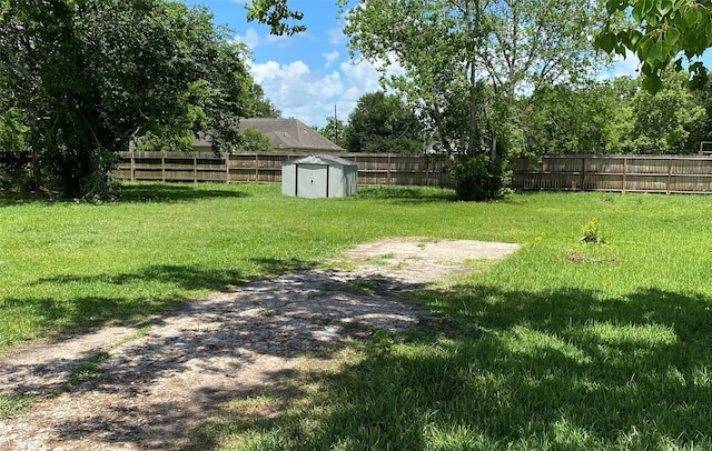 13023 Pleasant Valley Dr, Rosharon, TX 77583 - fenced backyard featuring a storage unit