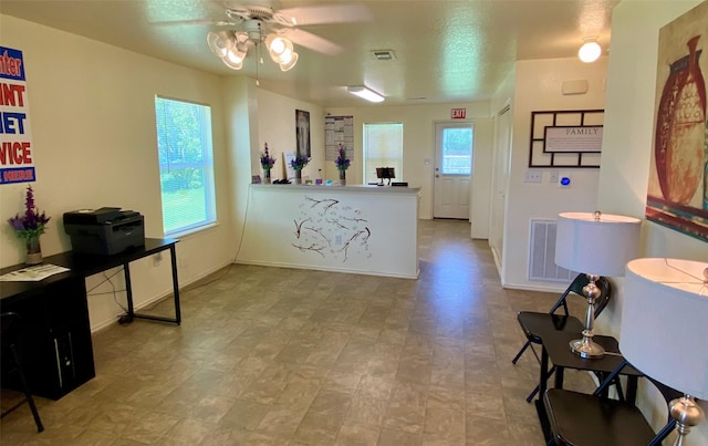 13023 Pleasant Valley Dr, Rosharon, TX 77583 - kitchen featuring a ceiling fan and tile patterned floors