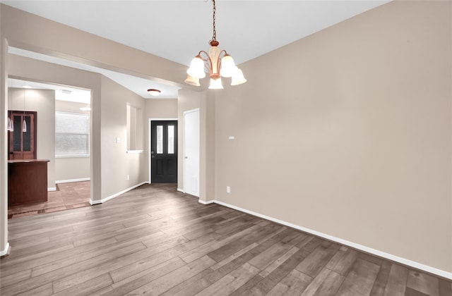4406 Park Trail Ln, Pasadena, TX 77505 - spare room featuring a chandelier and wood finished floors