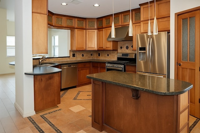 4406 Park Trail Ln, Pasadena, TX 77505 - kitchen with stainless steel appliances, wall chimney range hood, dark countertops, tasteful backsplash, and inlaid floor details